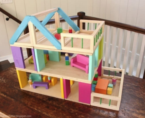 A doll house which is made from scrap wood